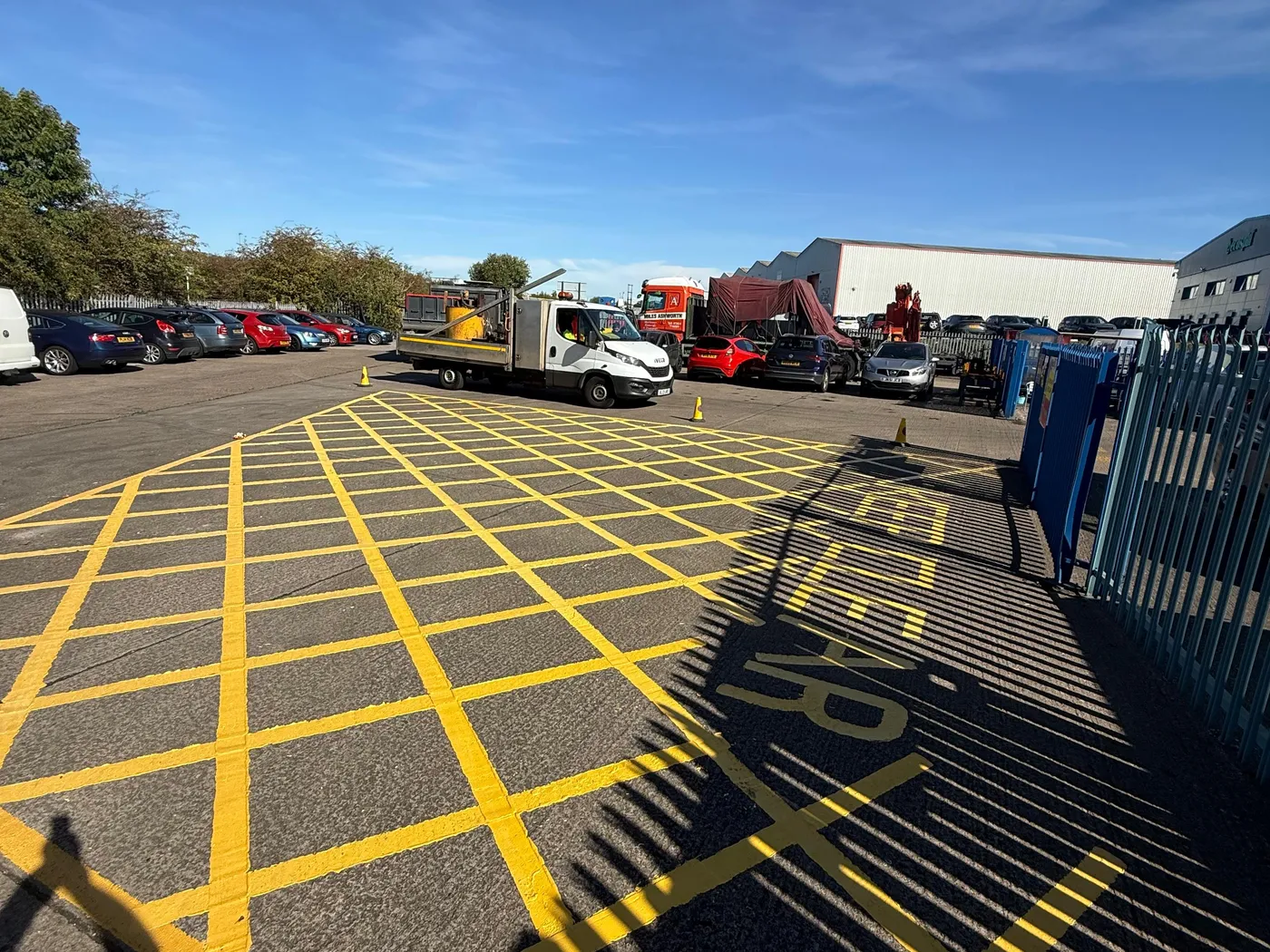 Yellow box junction markings in a yard