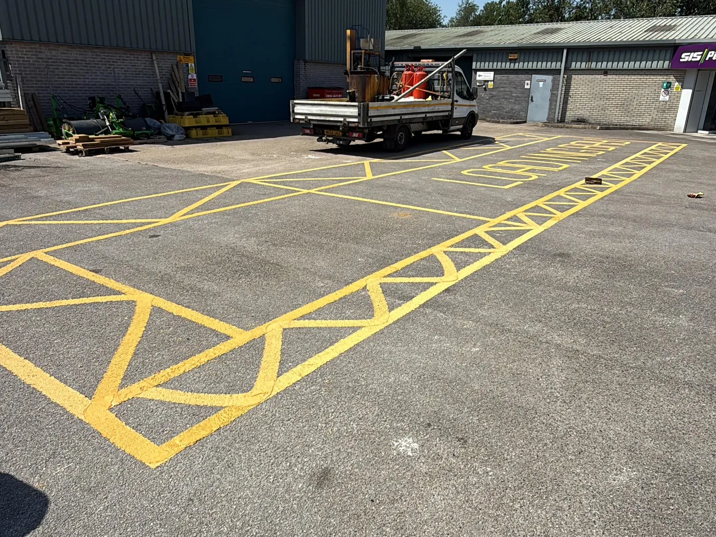 Thermoplastic hatching in a commercial yard